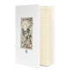Matte white hardcover notebook shown at an angle with its elastic closure band.