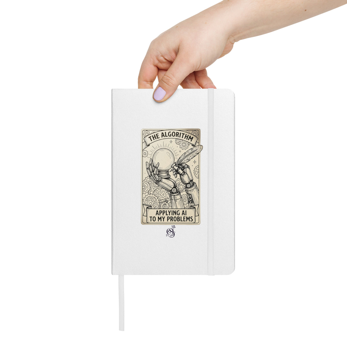 A hand holding the matte white hardcover notebook.