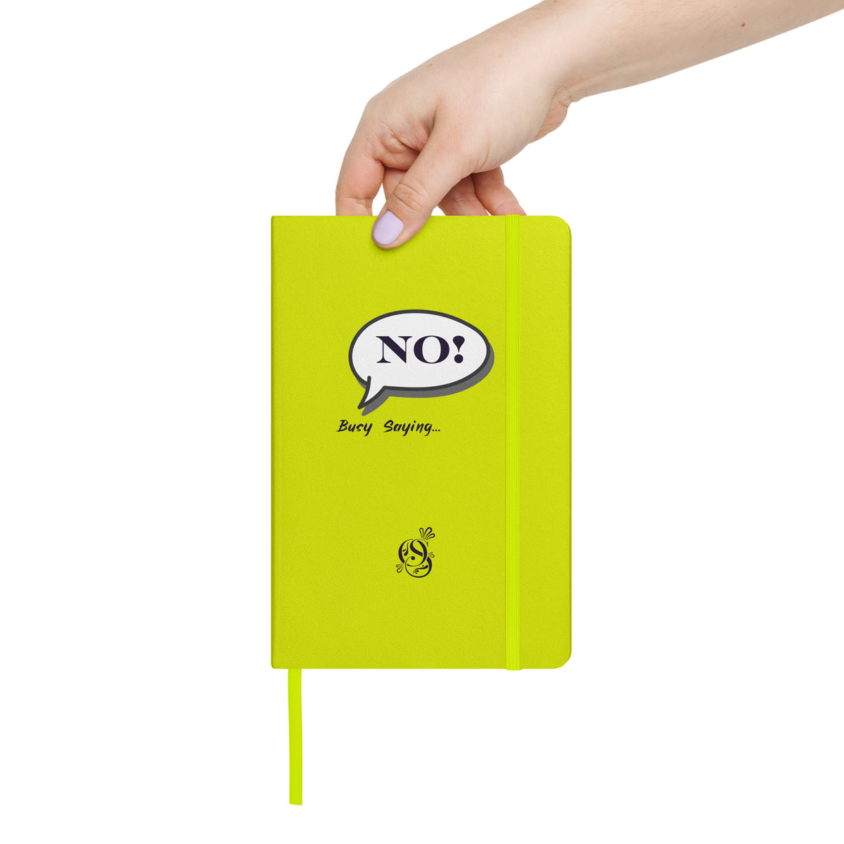 A hand holding the chartreuse hardcover notebook.