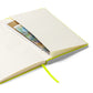Close-up of the notebook's expandable inner pocket, open to show storage space for loose notes or cards.