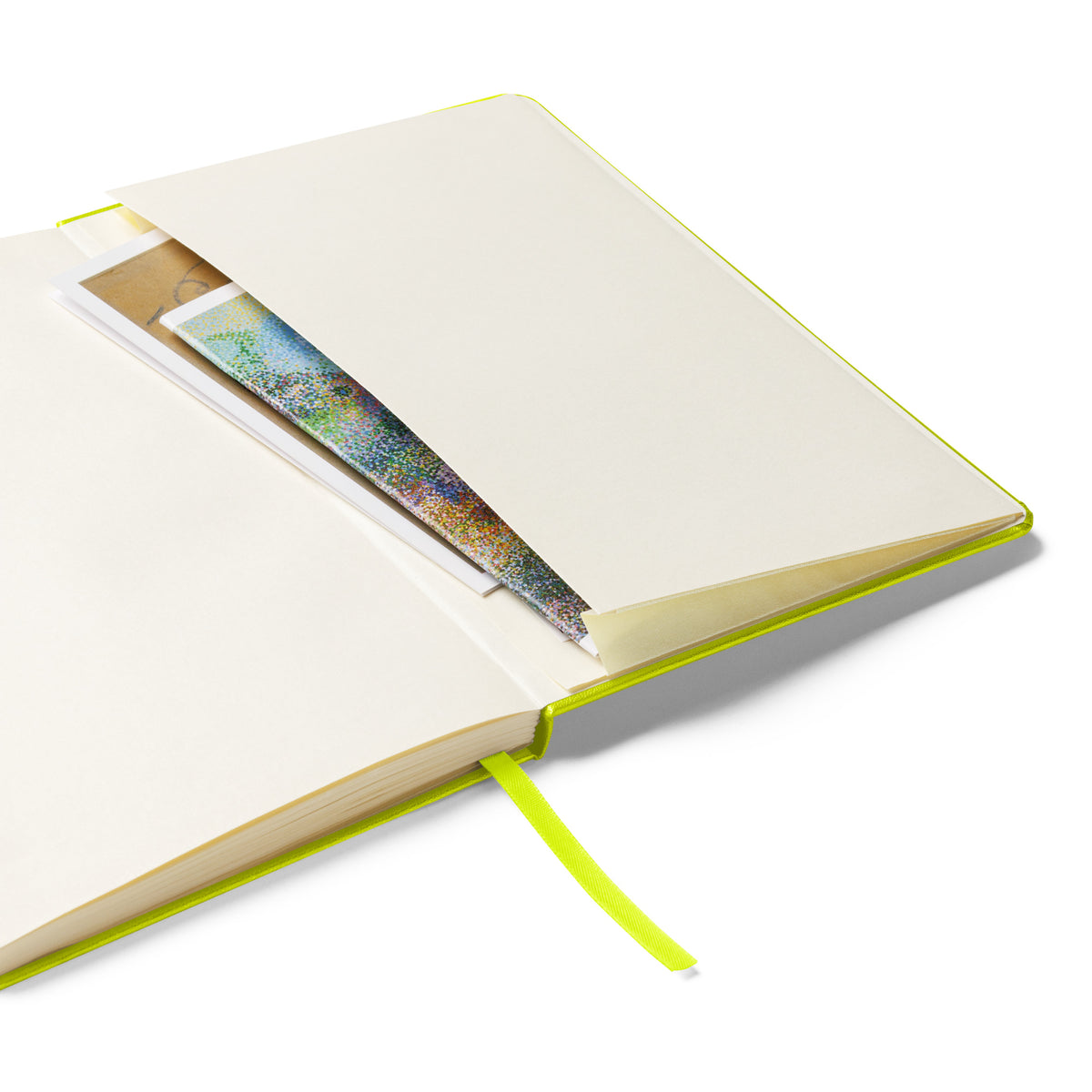 Close-up of the notebook's expandable inner pocket, open to show storage space for loose notes or cards.