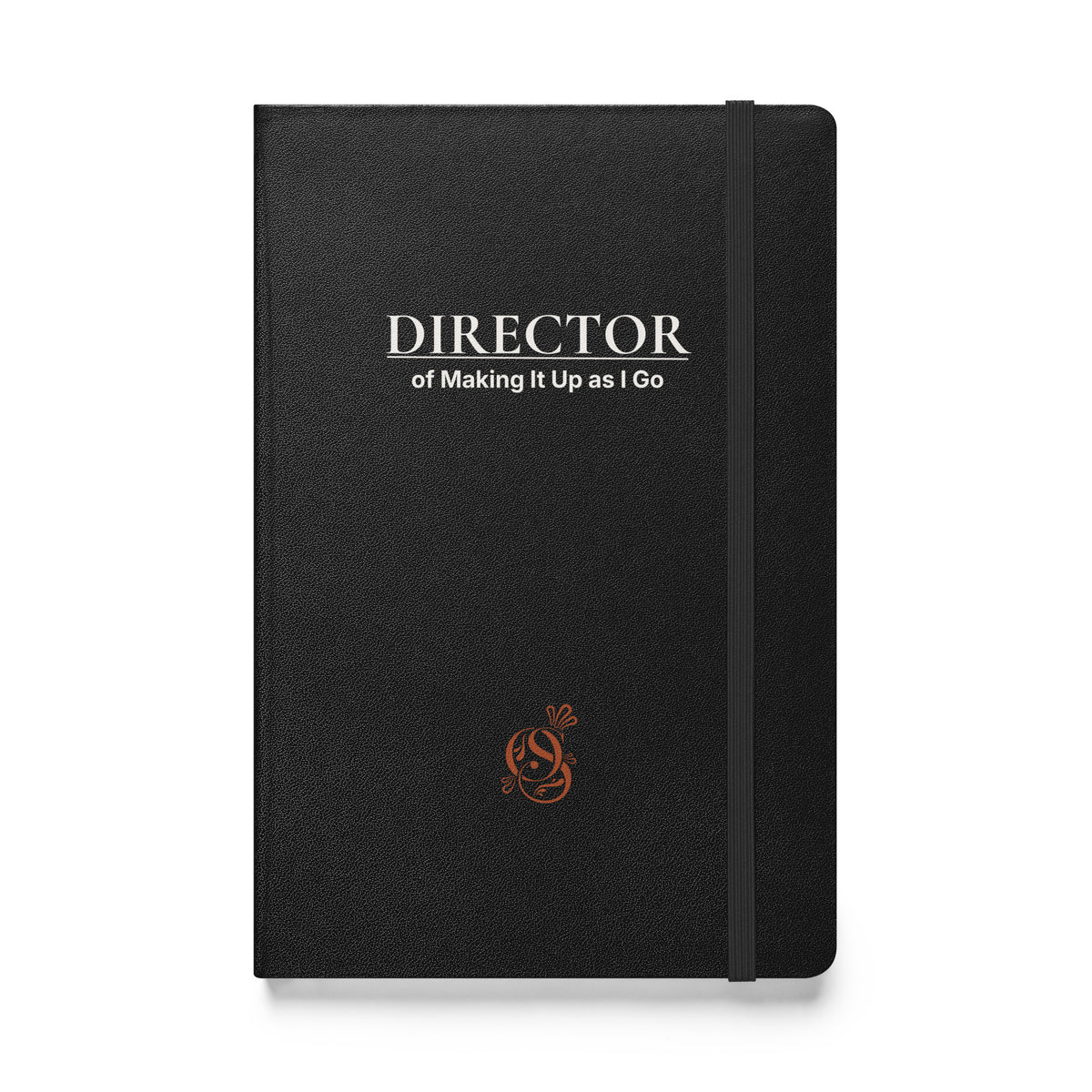 A5 hardcover notebook in charcoal matte black with "Director of Making It Up as I Go" on the cover.