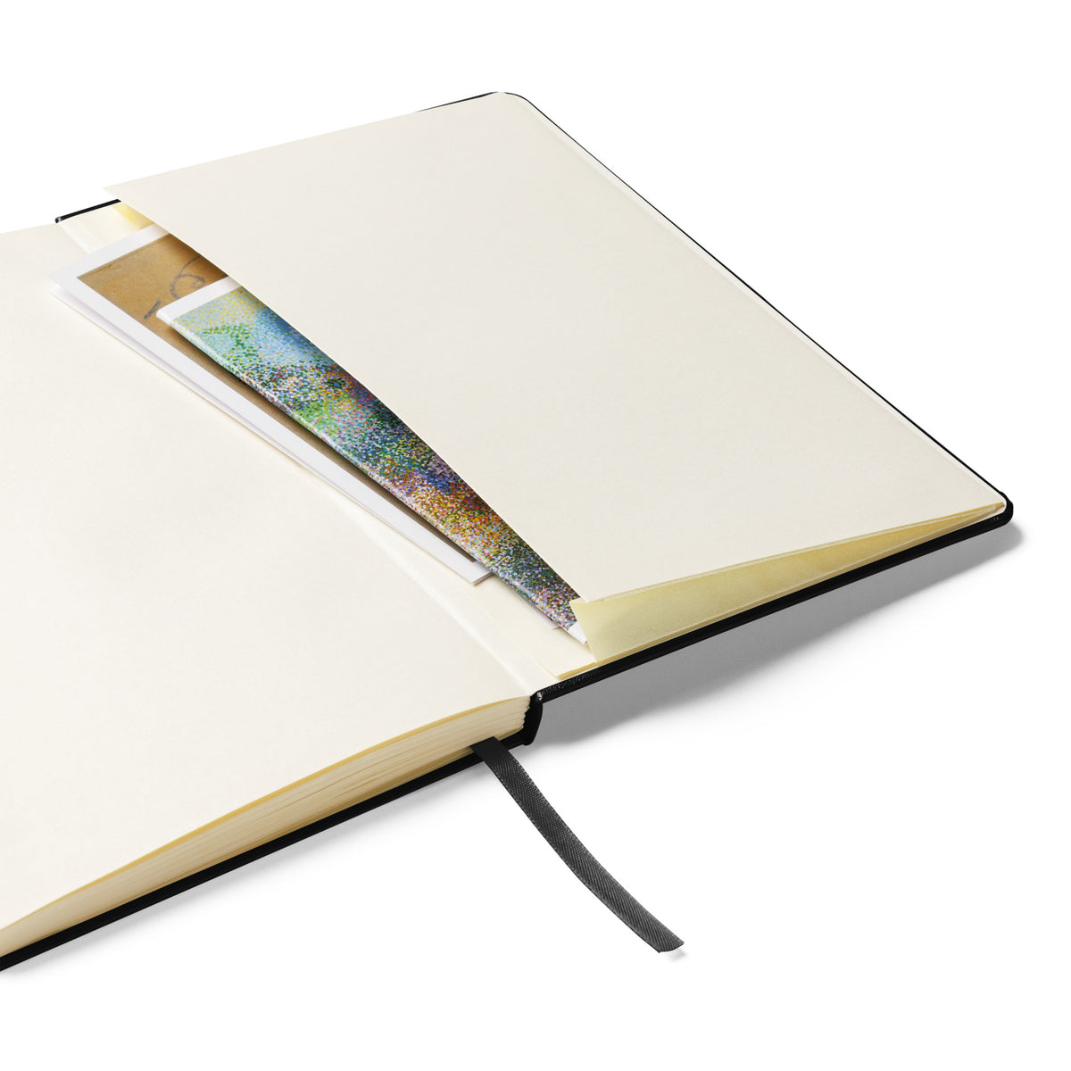 Close-up of the notebook's expandable inner pocket, open to show storage space for loose notes or cards.