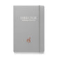 A5 hardcover notebook in matte silver-gray with "Director of Making It Up as I Go" on the cover.