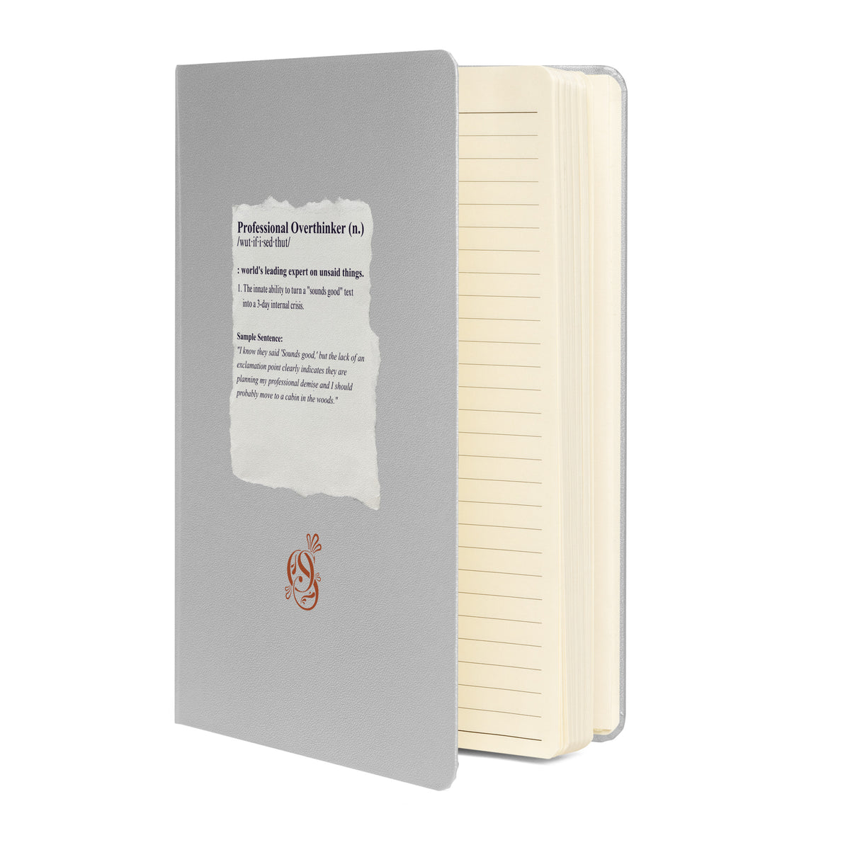 Matte silver-gray hardcover notebook shown at an angle with its elastic closure band.