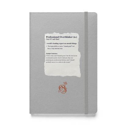 A5 hardcover notebook in matte silver-gray with "Professional Overthinker" on the cover.