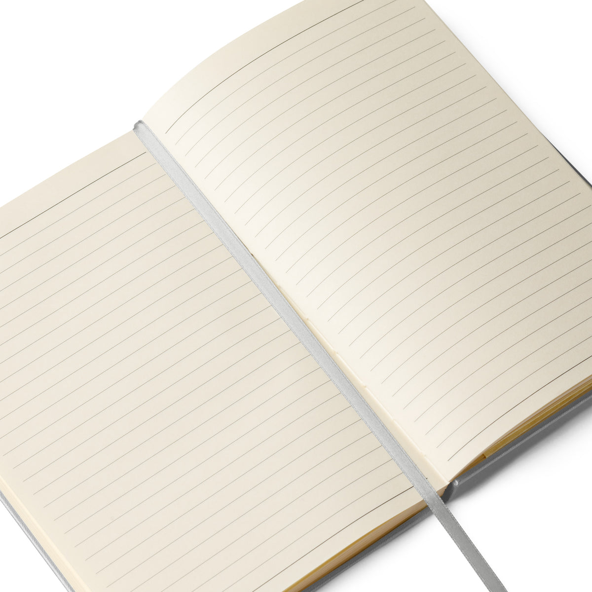 Open notebook showing cream lined pages and ribbon page marker.