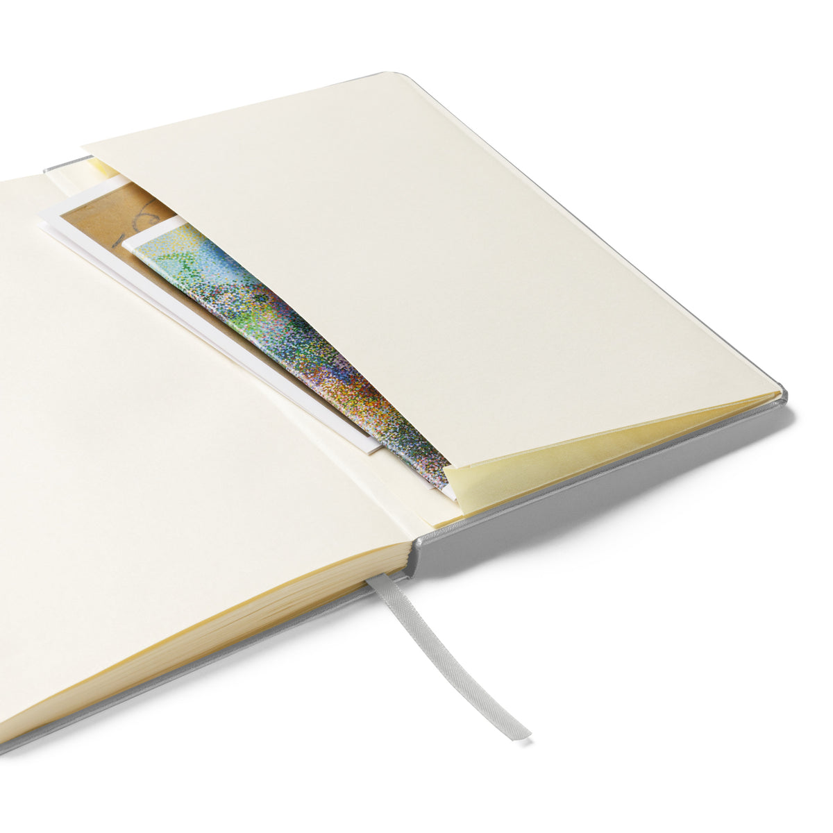 Close-up of the notebook's expandable inner pocket, open to show storage space for loose notes or cards.